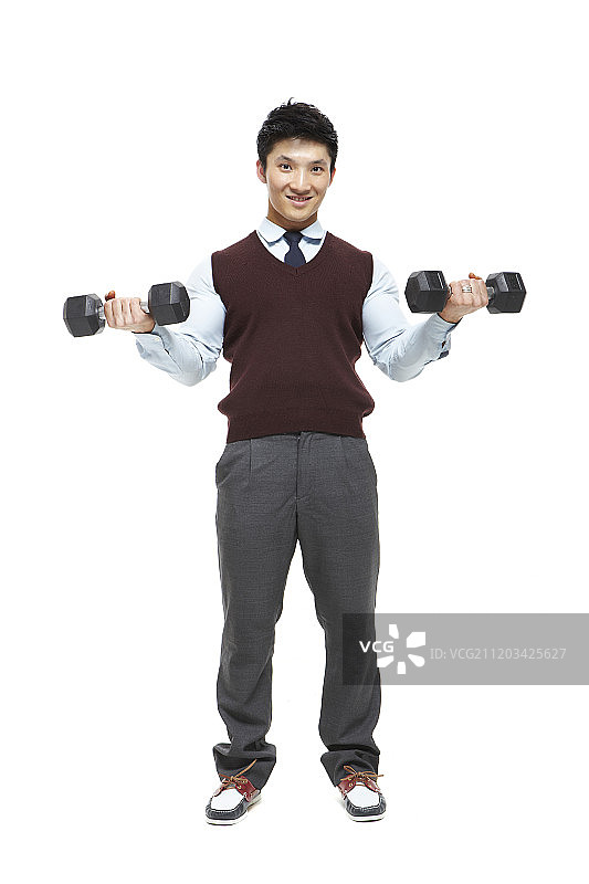 男人用哑铃锻炼的摄影作品图片素材