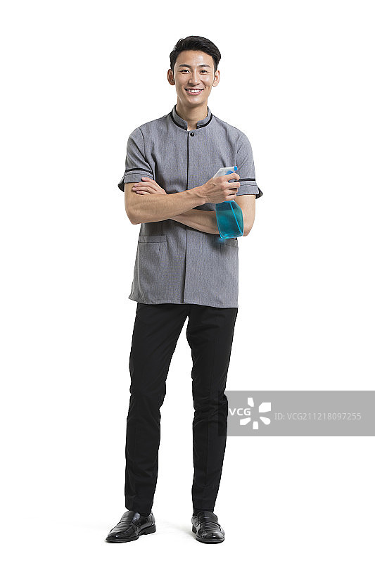 开心的保洁员拿着清洗液图片素材