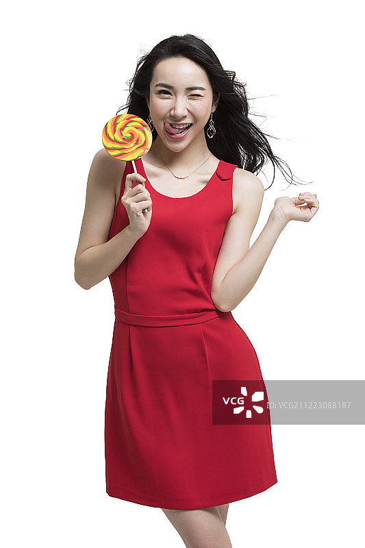 年轻时尚女性拿着棒棒糖图片素材