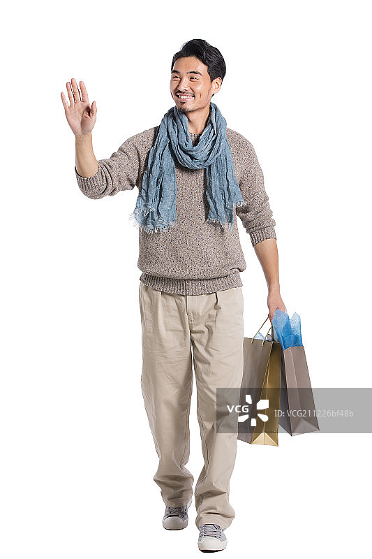 青年男人手提购物袋图片素材