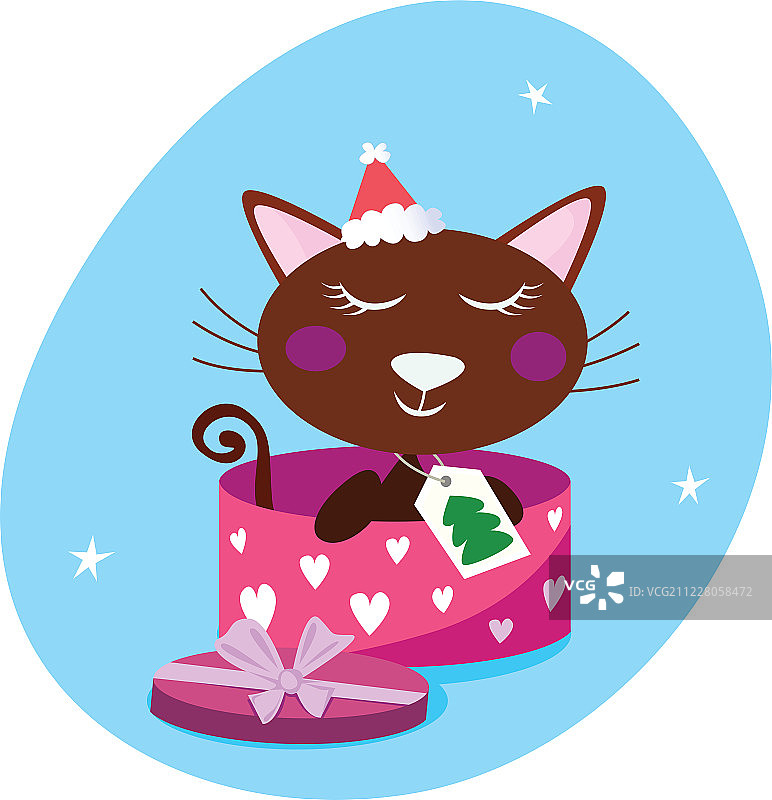粉色礼品盒中的棕色圣诞猫图片素材