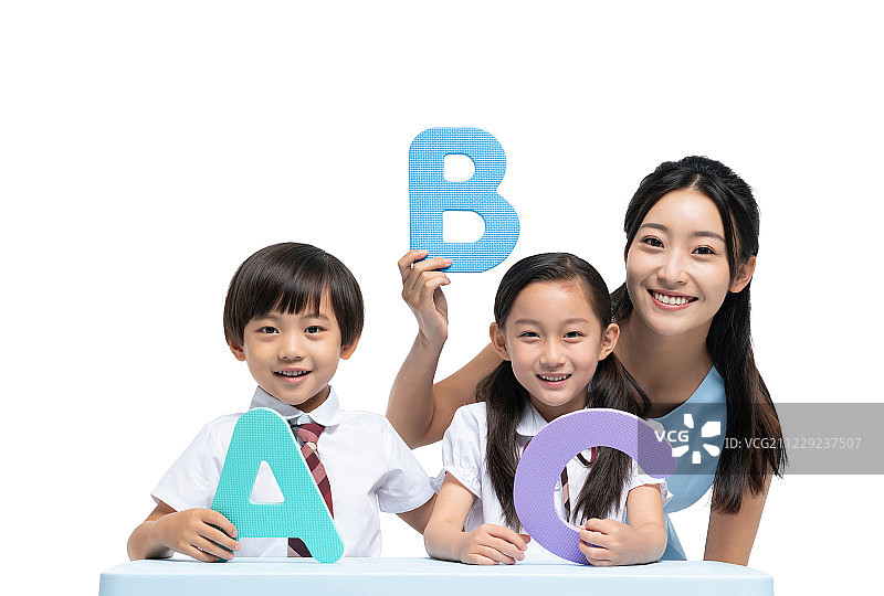 年轻女老师辅导学生学习图片素材