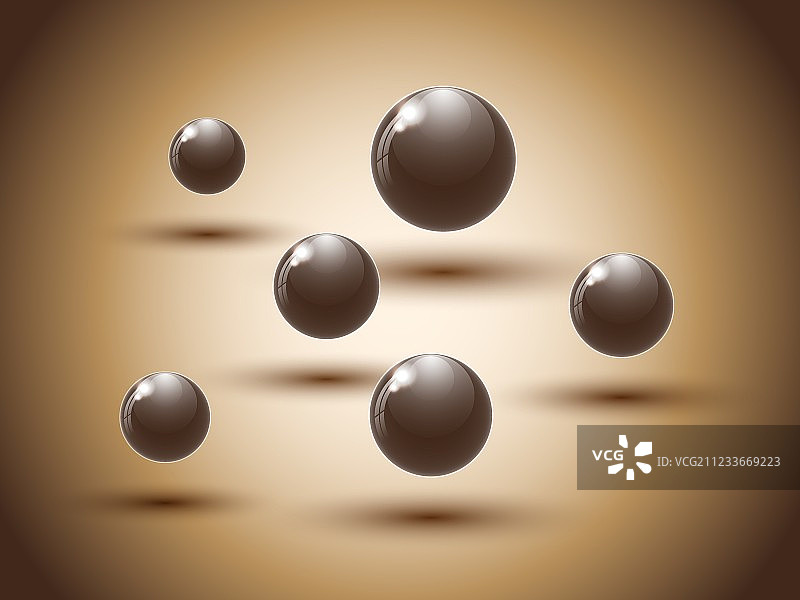 彩色背景上的棕色巧克力球图片素材