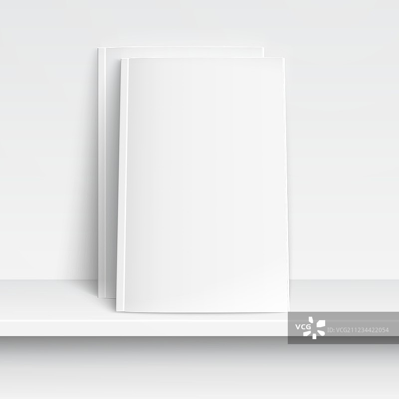 白色书架上的两本空白杂志图片素材