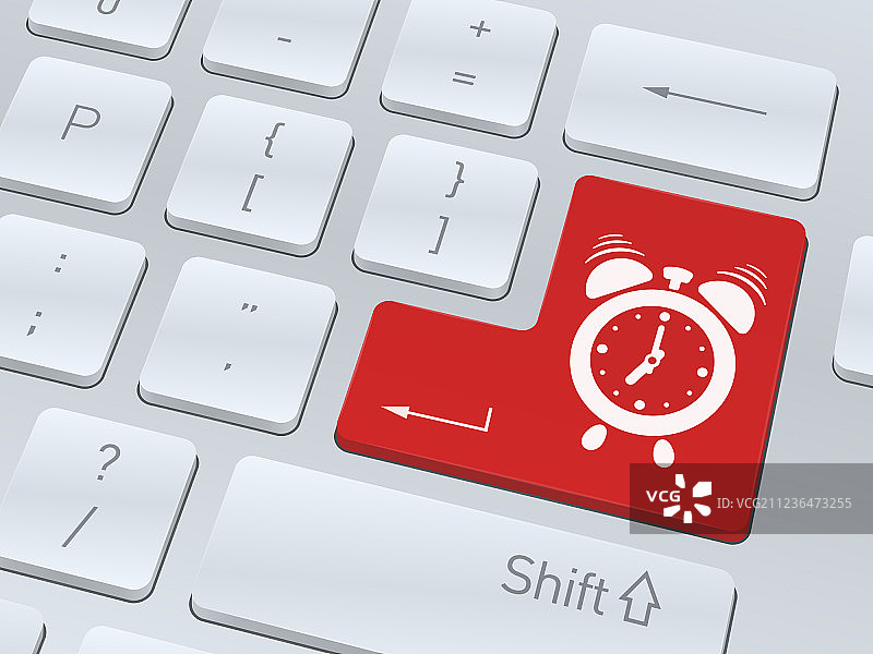 白色电脑键盘上的闹钟图标图片素材