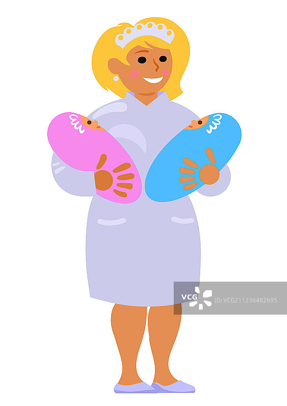 孕产科护士抱着两个微笑的婴儿图片素材