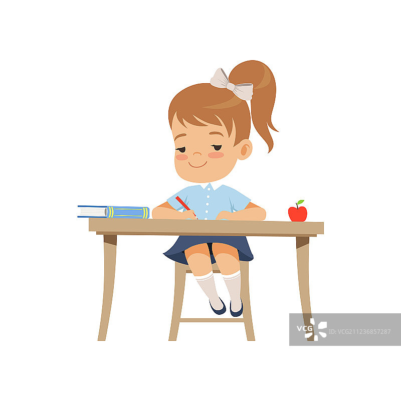坐在书桌前写作的可爱女孩图片素材
