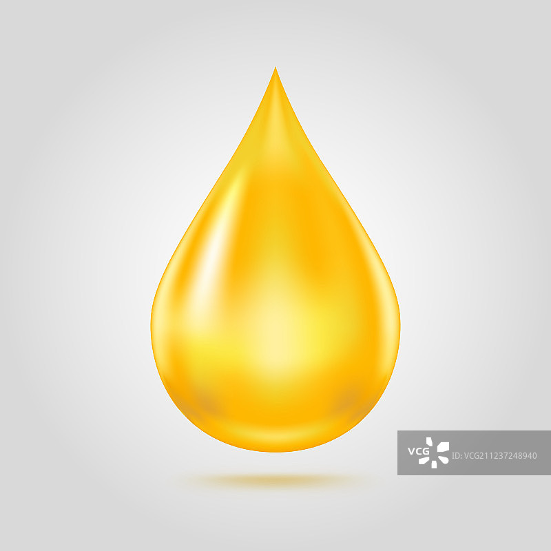 浅灰色背景上隔离的金色油滴图片素材