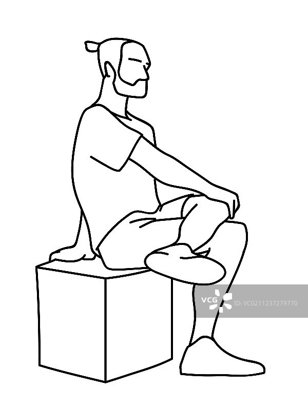 男人坐在立方体上，一只脚抬起图片素材