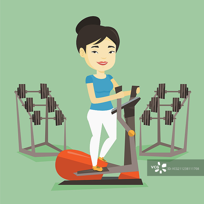 在椭圆机上锻炼的女人图片素材