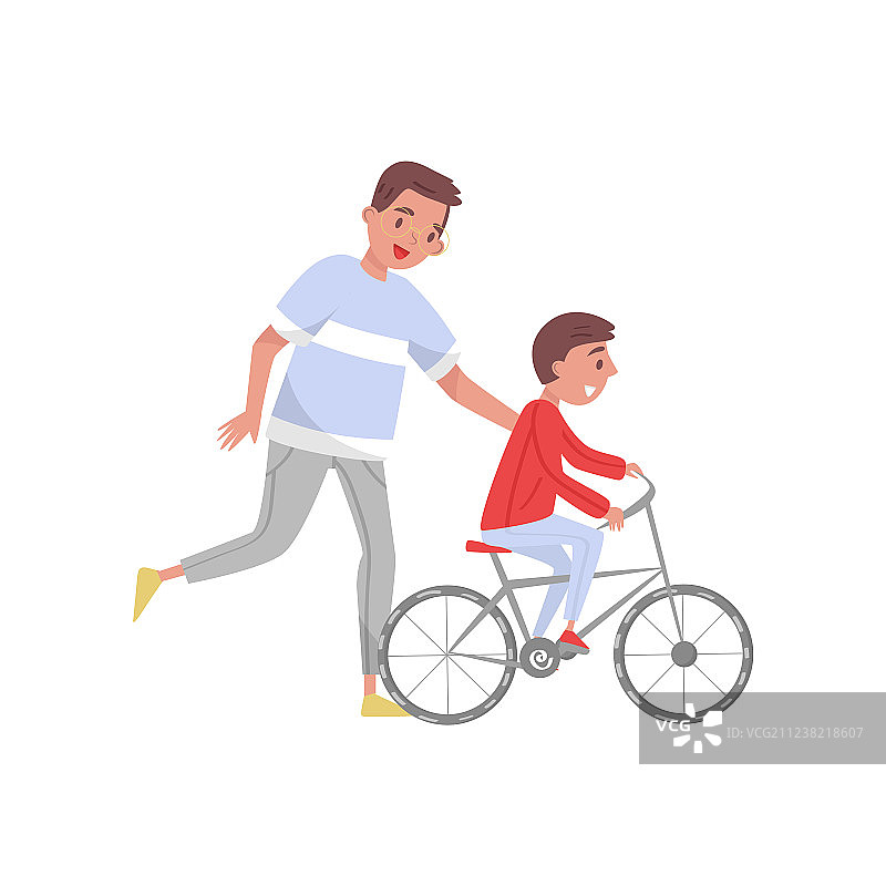 快乐的父亲教儿子骑自行车图片素材