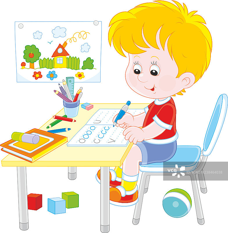 男孩玩完玩具后正在做作业图片素材