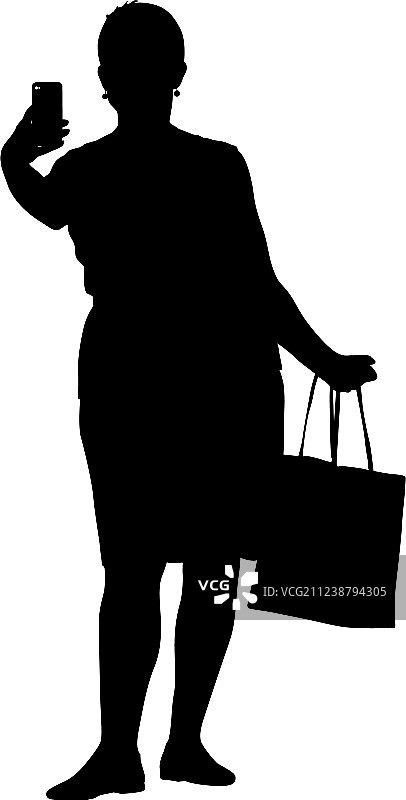 女人用智能手机自拍剪影图片素材