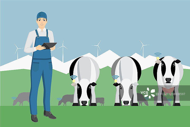 在牧场上手持平板电脑的农民图片素材