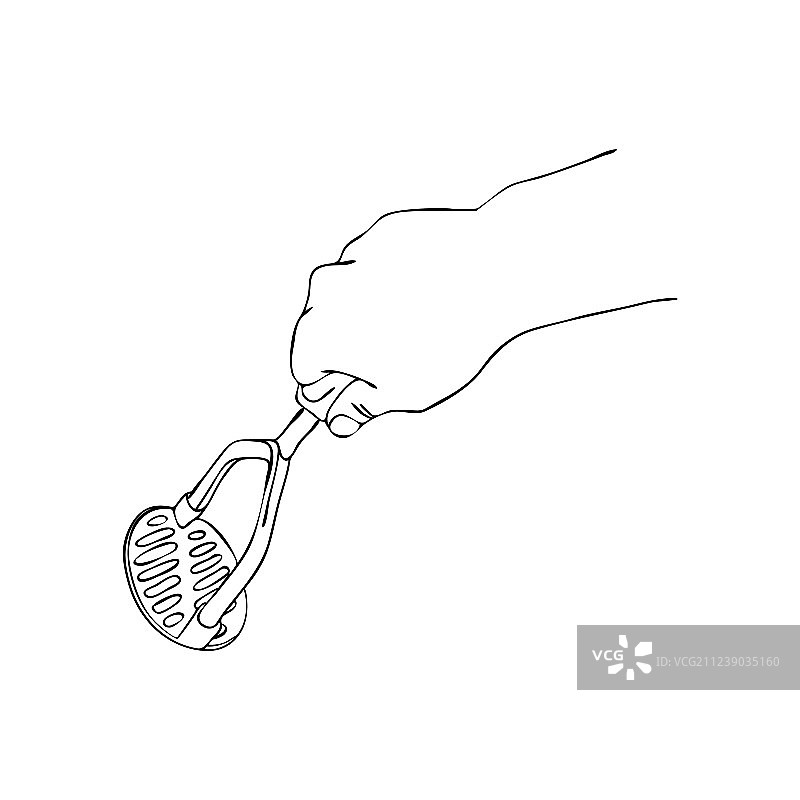 手持土豆泥压泥器烹饪图片素材