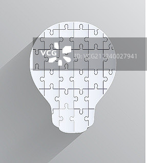 带有拼图碎片的创意灯泡设计图片素材
