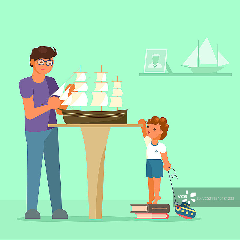 父亲和儿子制作帆船模型图片素材