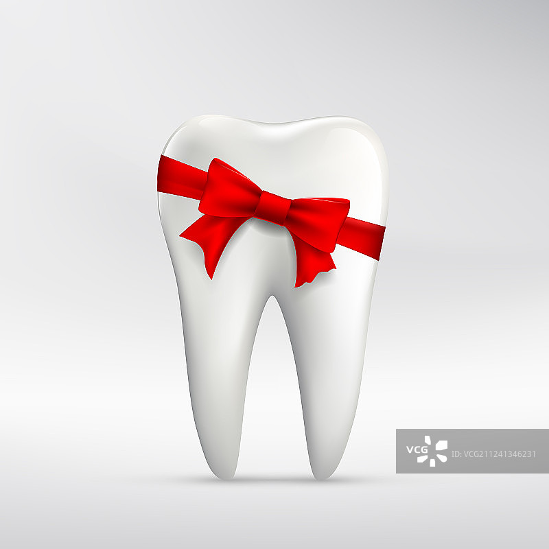 系着红色丝带的人类牙齿图片素材