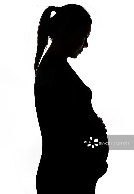 孕妇抚摸肚子图片素材