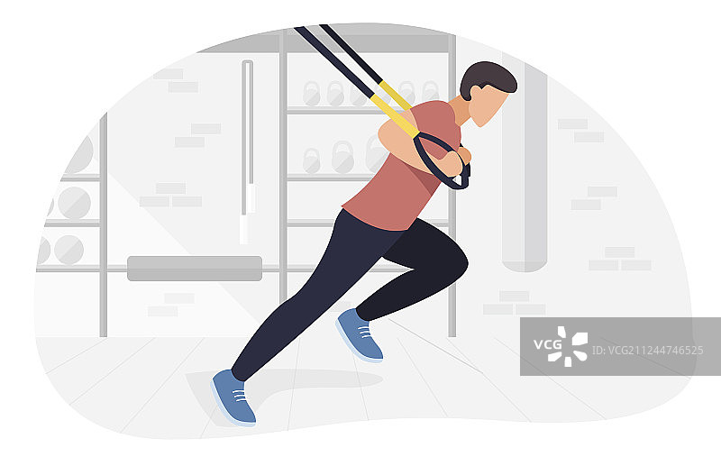 在TRX上进行自重训练的健壮男人图片素材