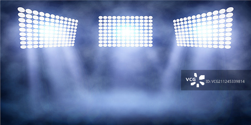 烟雾中夜晚体育场的聚光灯塔图片素材