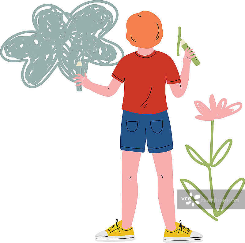 可爱男孩用彩色铅笔在墙上绘画图片素材