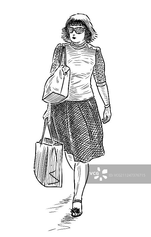 带着购物袋的年轻女子图片素材