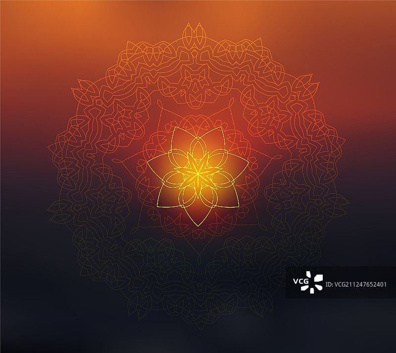 日落模糊背景上的闪亮花卉曼陀罗图片素材