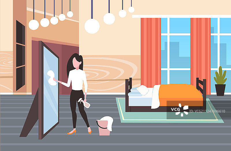 家庭主妇使用抹布和喷雾瓶清洁图片素材