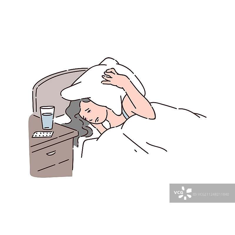 失眠的女人用枕头蒙住头图片素材