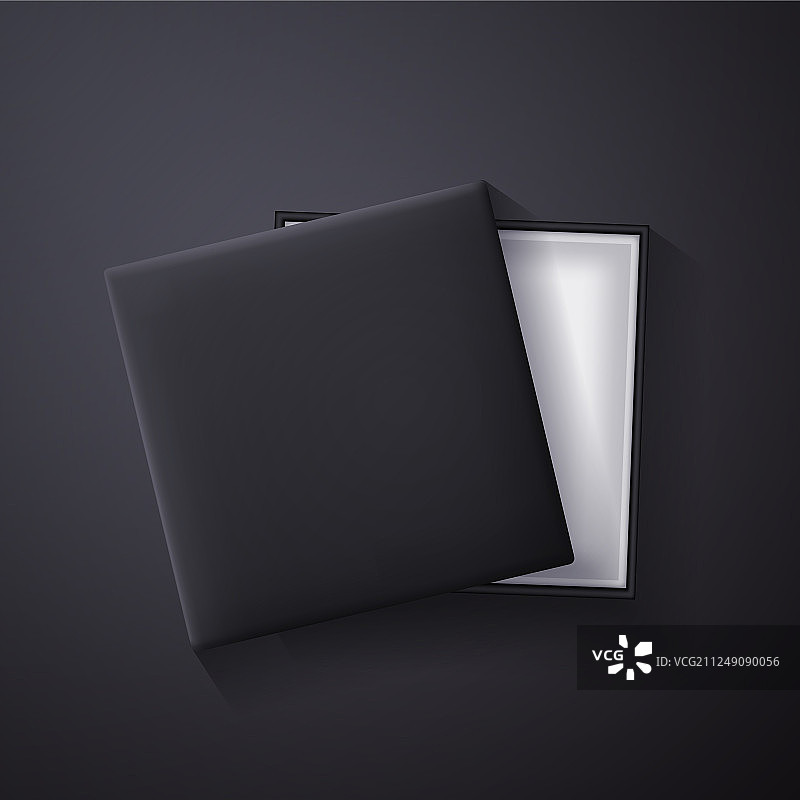 深色背景上的黑色空礼品盒图片素材