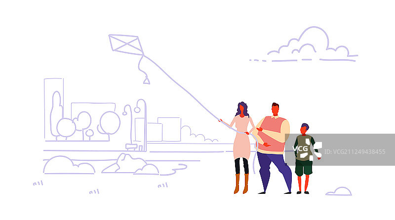 幸福家庭在城市公园放风筝图片素材