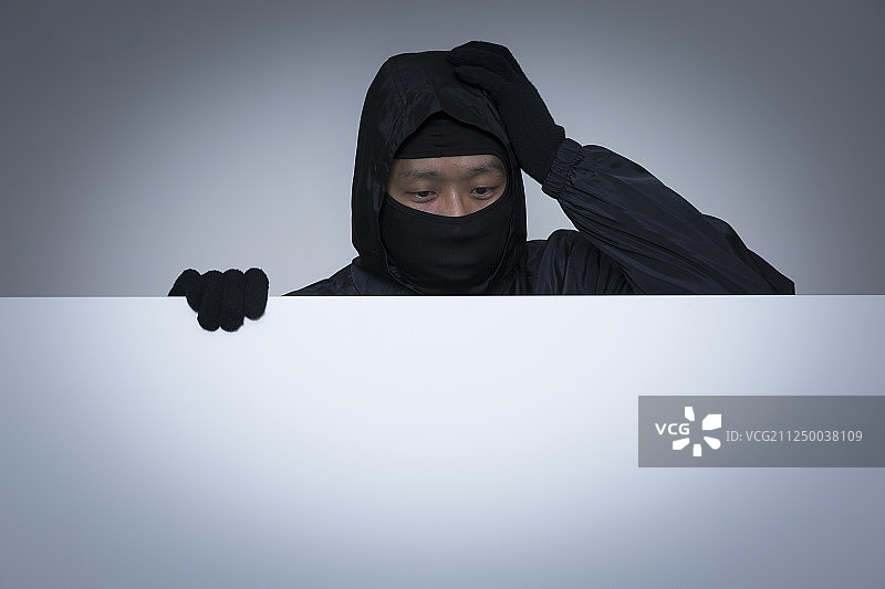 戴黑色面具的男窃贼概念照片091图片素材