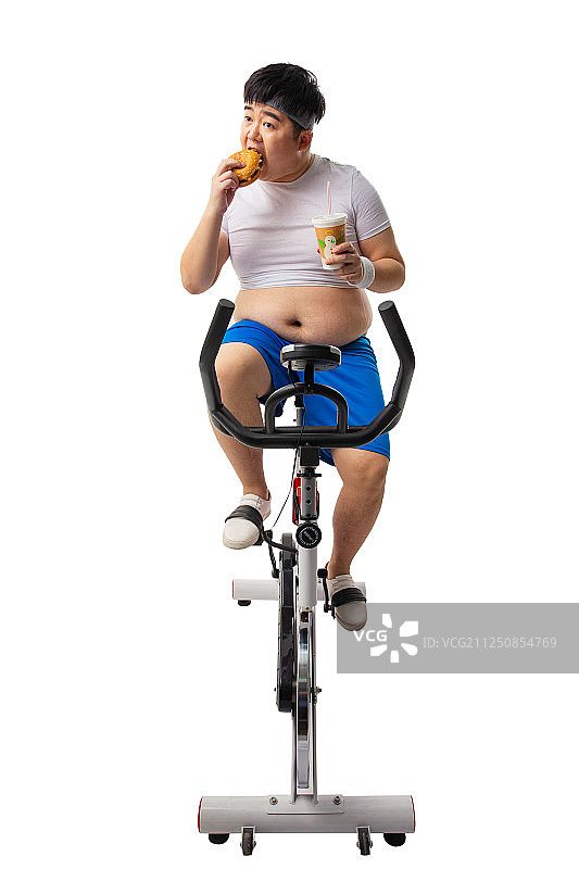 小胖边吃边健身图片素材