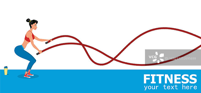 年轻女运动员用战绳锻炼图片素材