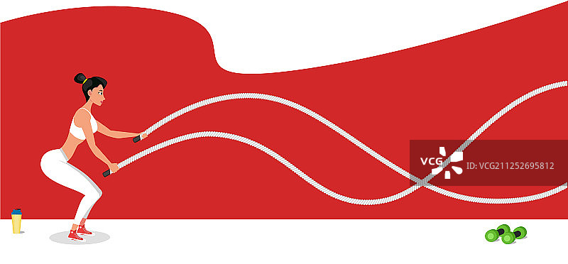 年轻女运动员用战绳锻炼图片素材