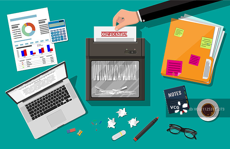 手将纸张放入碎纸机图片素材