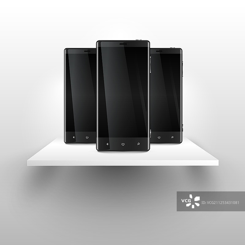 货架上的三部手机图片素材