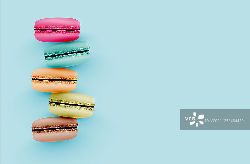 蓝色背景上的高细节彩色马卡龙图片素材