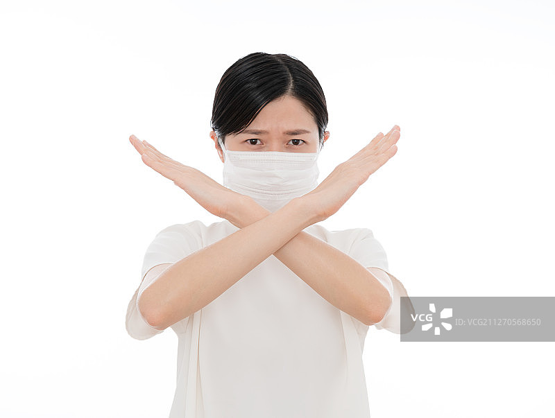 戴口罩戴女生手交叉表示拒绝或者错误图片素材
