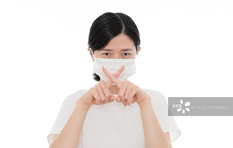 戴口罩戴女生手交叉表示拒绝或者错误图片素材
