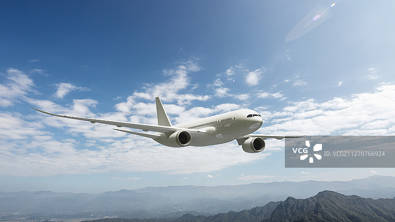 商用_喷气_客机_飞跃群山图片素材