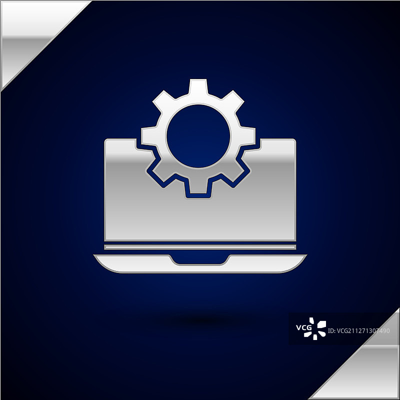 深蓝色背景上的银色笔记本电脑和齿轮图标图片素材