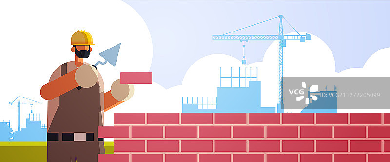 男人用刮刀铺砖图片素材