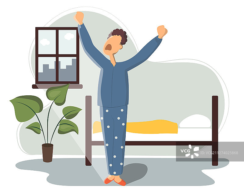 男人在床上睡觉，醒来并打哈欠图片素材