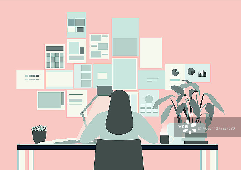 在粉色办公室里工作的长发女人图片素材