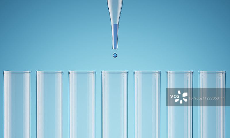 用滴管向试管中滴入蓝色的液体图片素材