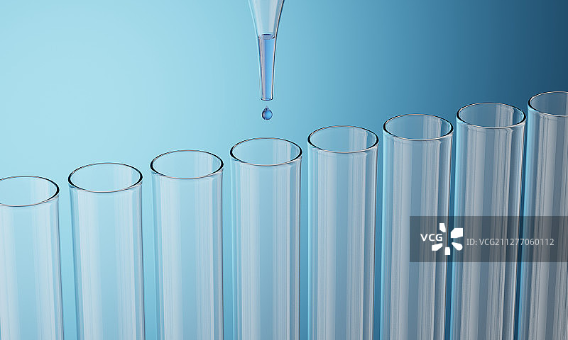 用滴管向试管中滴入蓝色的液体图片素材