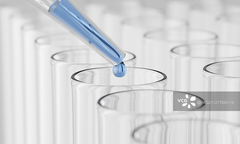 用滴管向试管中滴入蓝色的液体图片素材