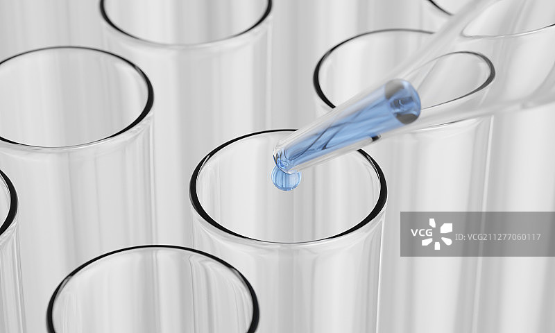 用滴管向试管中滴入蓝色的液体图片素材